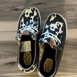 Hey Dude Black and White Cow Print Shoes